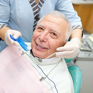 Older patient visiting implant dentist in Colorado Springs for checkup