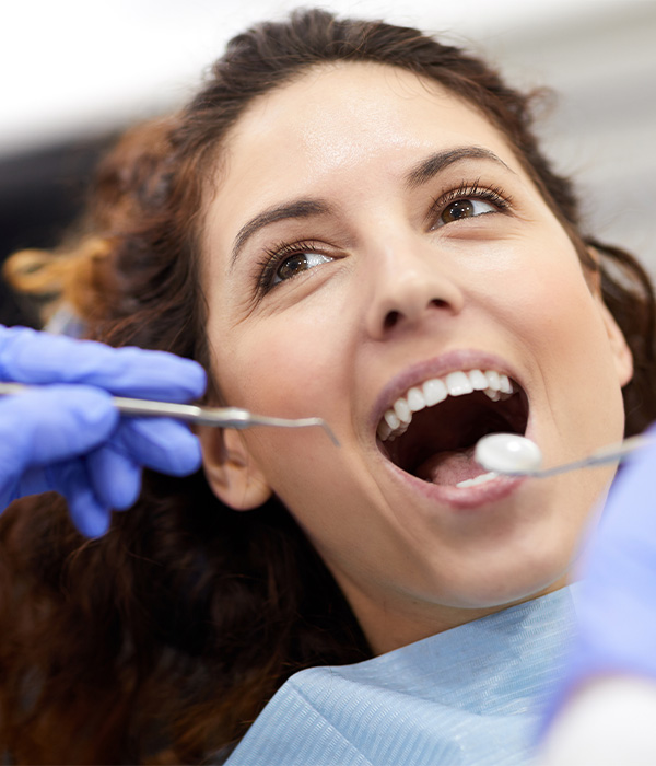 A woman having her teeth cleaned
