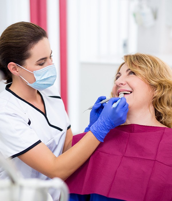  man smiling in dental mirror