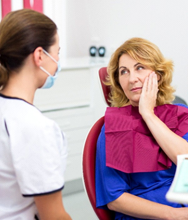 Female patient with a failed dental implant in Colorado Springs