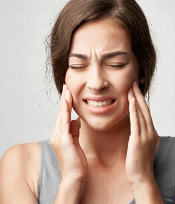 Woman with a failed dental implant in Colorado Springs