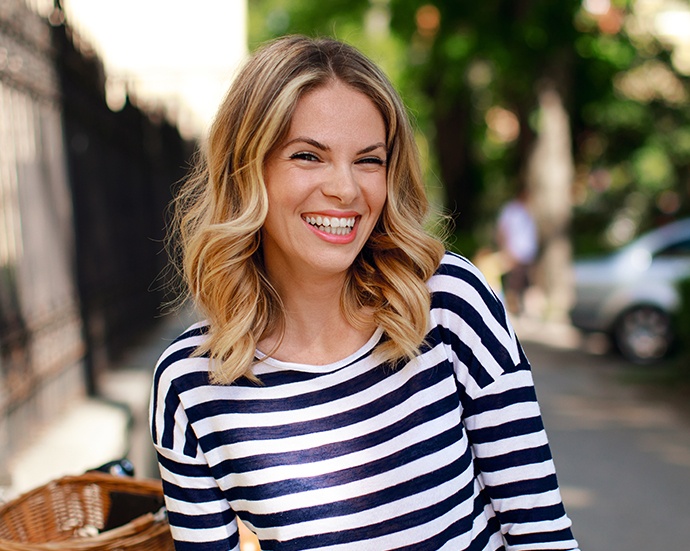 Woman sharing gorgeous smile after gum grafting