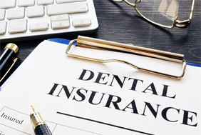 a dental insurance form on a table