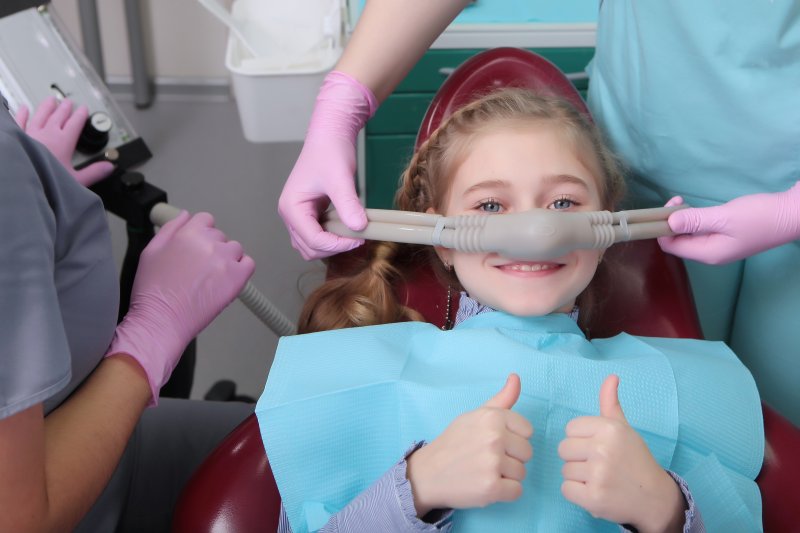 A little girl receiving the benefits of sedation dentistry