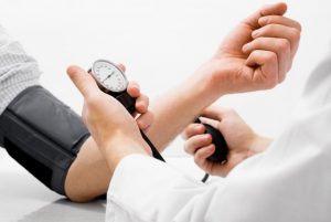 a patient having their blood pressure checked