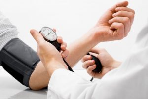 a patient having their blood pressure checked 